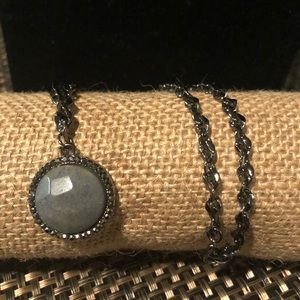 Woman’s pewter necklace and grey stone